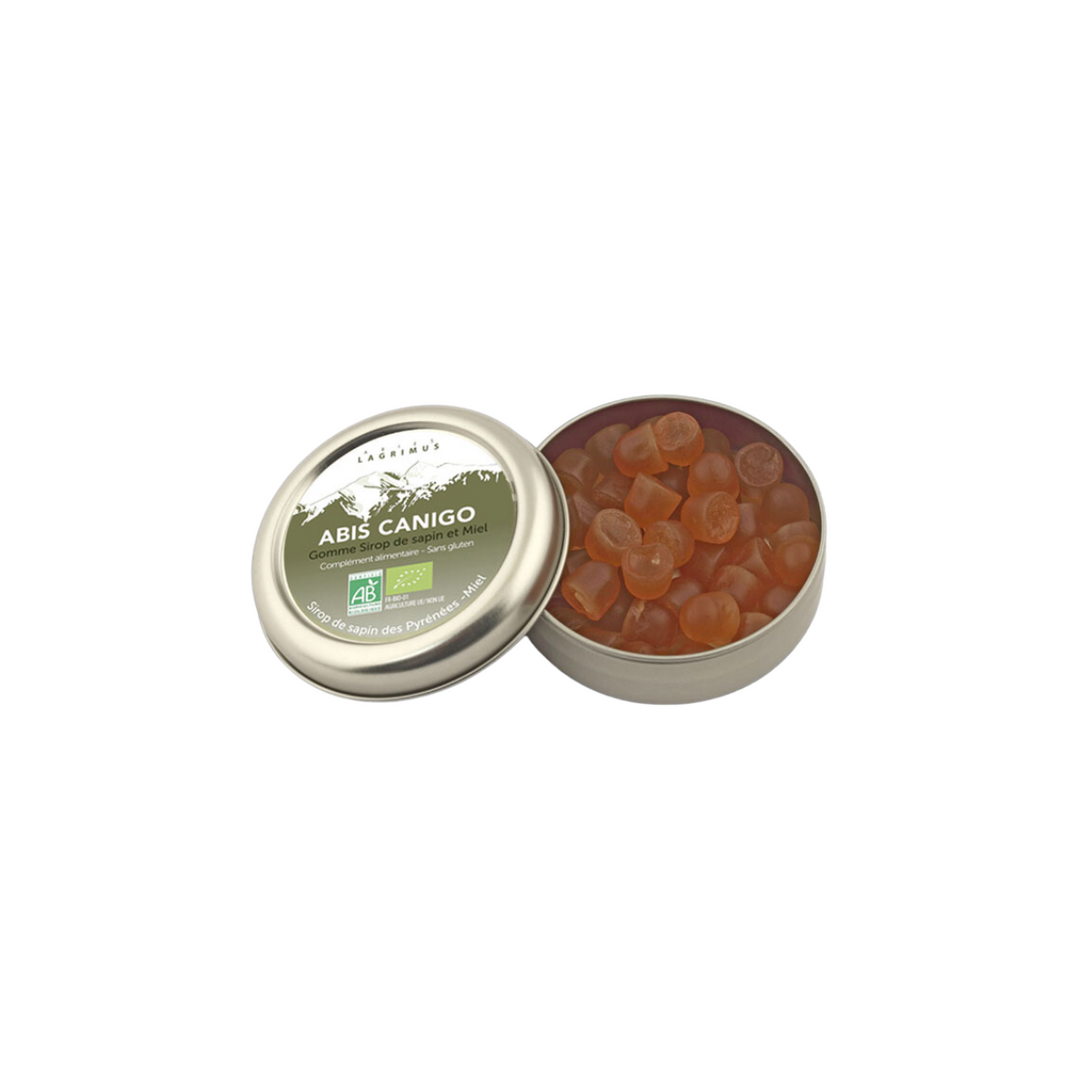 Boîte en métal ouverte de gommes tendres bio au sirop de sapin et miel Abis Canigo