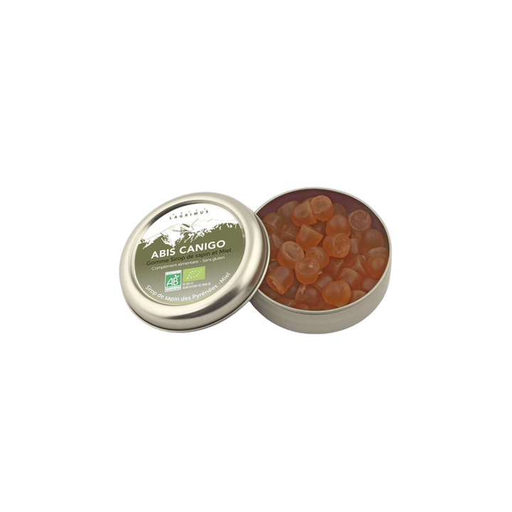Boîte en métal ouverte de gommes tendres bio au sirop de sapin et miel Abis Canigo